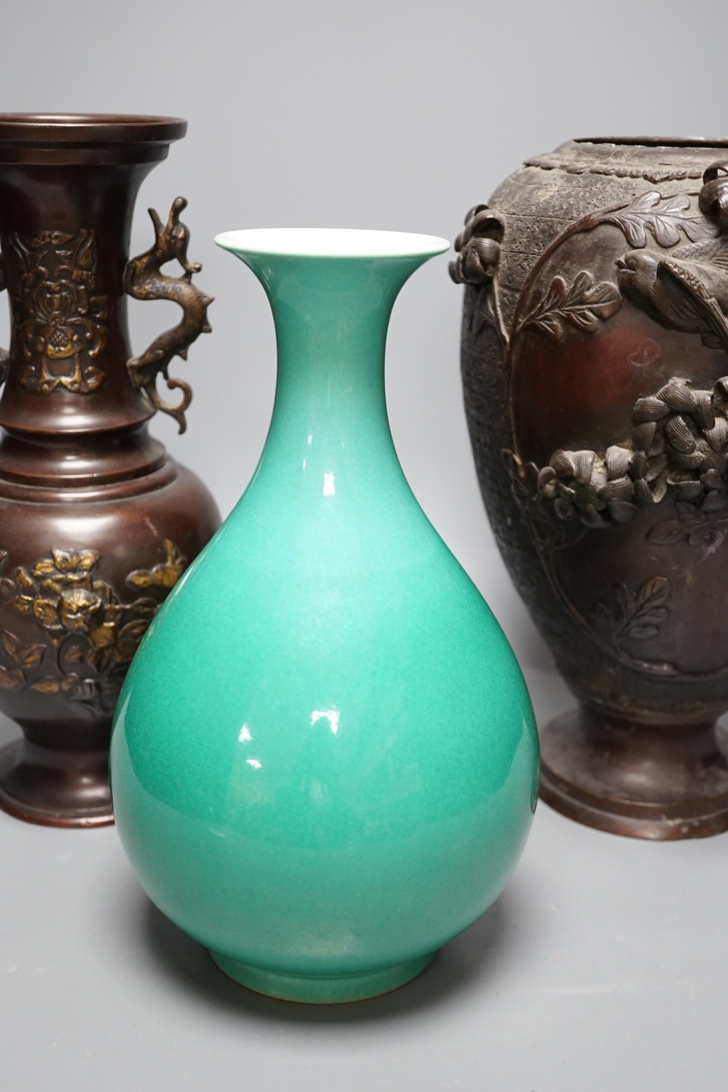A Chinese green glazed vase with Qianlong seal mark to base and two Japanese bronze vases, tallest 29.5cm